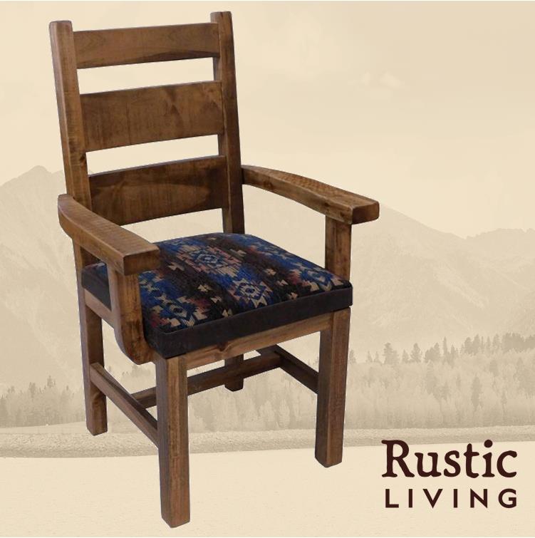 Rustic Farmhouse high back frisco dining chair with arms handmade in America using solid wood custom made for your mountain cabin, lodge, farmhouse, ranch and western lifestyle. A rustic high back dining chair with arms made of solid wood, featuring a blue upholstered seat cushion.