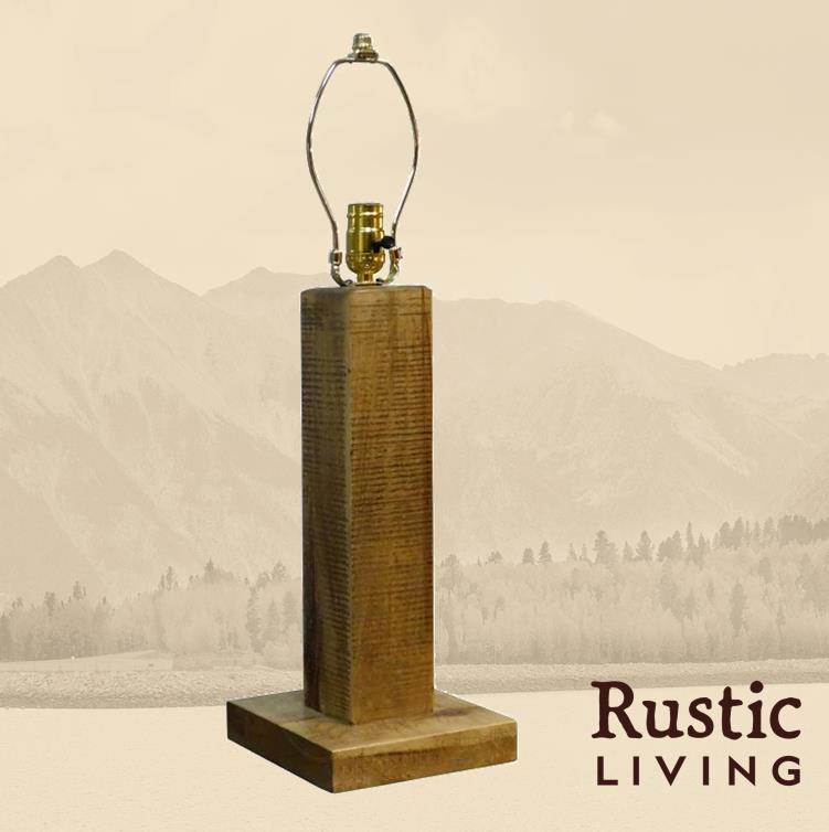 A rustic style table lamp with a wooden base.