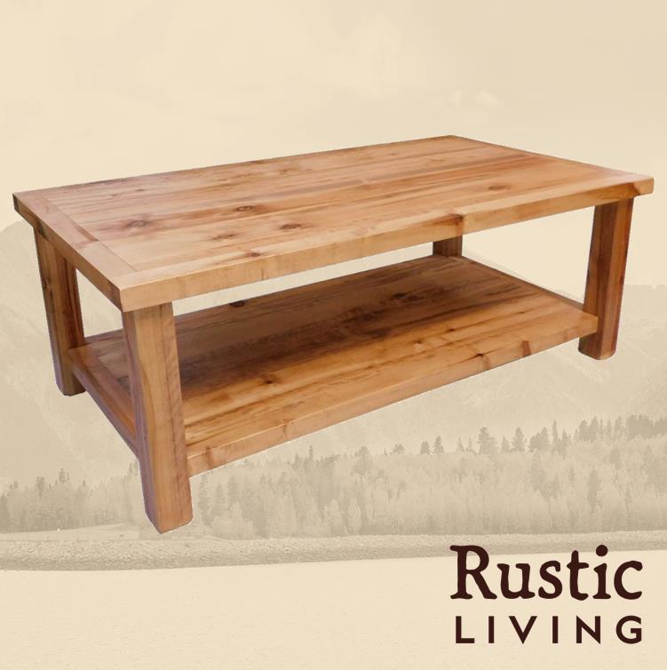 Rustic Farmhouse coffee table handmade in America using solid wood custom made for your mountain cabin, lodge, farmhouse, ranch and western lifestyle. A rustic wooden coffee table with a lower shelf, placed on a soft surface with a rustic living logo below.