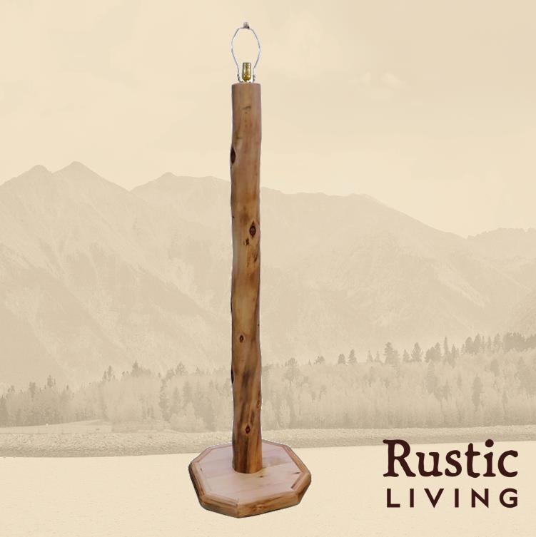 A floor lamp with a rustic wooden log base and a natural finish.
